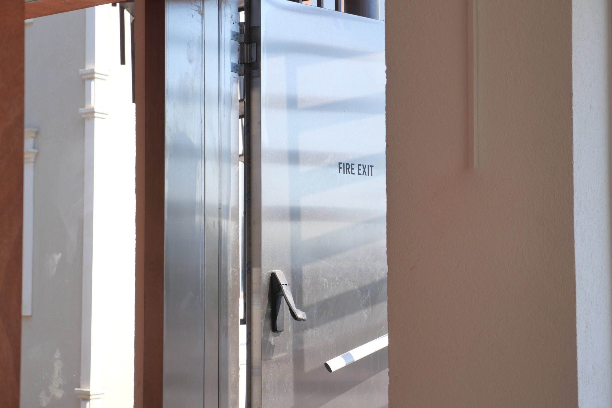Metal fire exit door with push bar handle